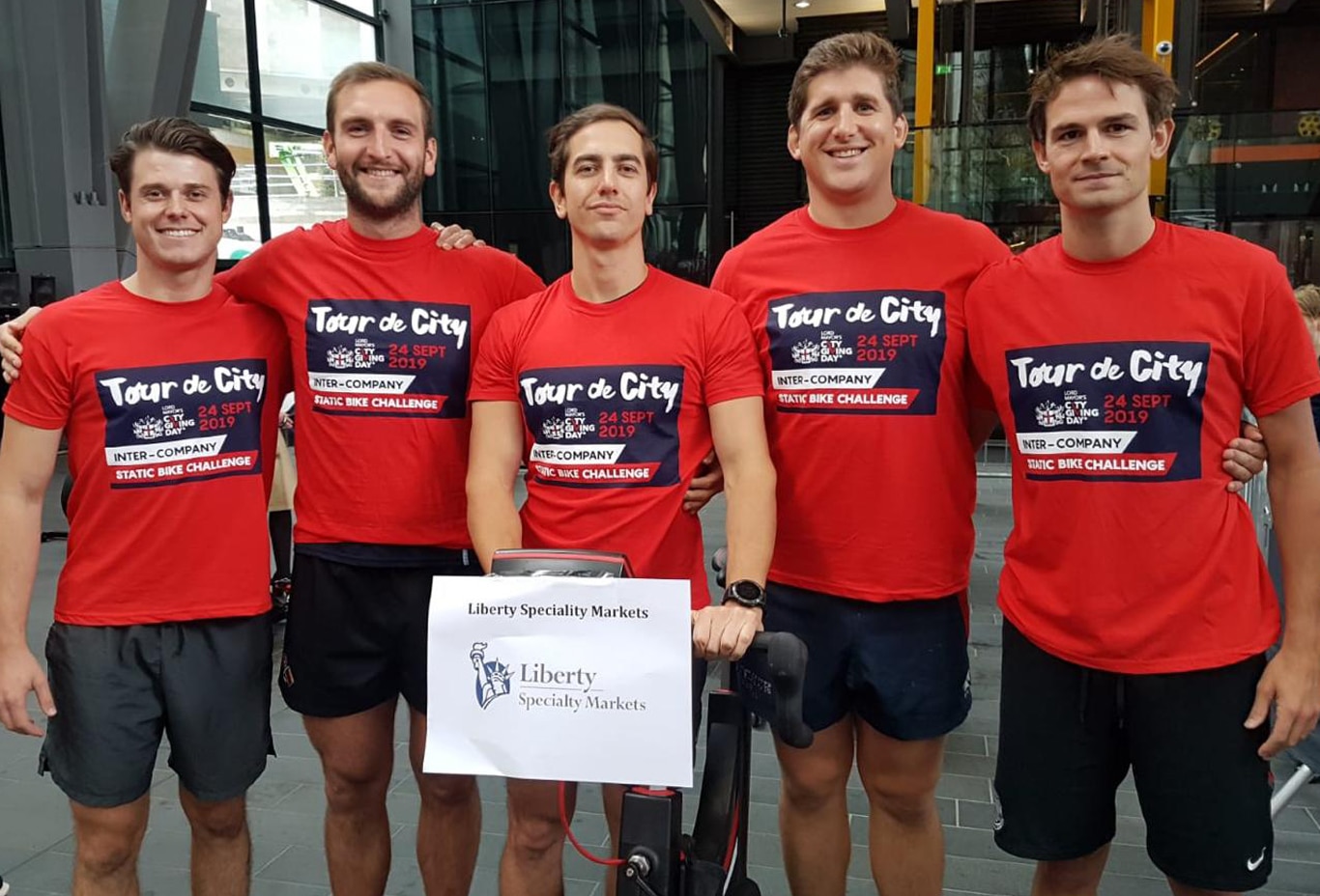 Five employees in matching shirts representing Liberty Specialty Markets at City Giving Day